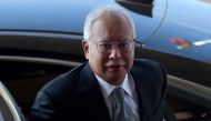 Malaysia's former prime minister Najib Razak arrives at the Kuala Lumpur High Court for his trial over 1MDB corruption allegations in Kuala Lumpur on April 15, 2019. Malaysia OUT / AFP / STR 
