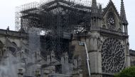 Firefighters work at Notre-Dame Cathedral in Paris, France April 16, 2019. A massive fire consumed the cathedral on Monday, gutting its roof and stunning France and the world. REUTERS/Yves Herman