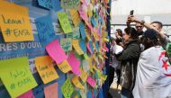 Students write their demands as they stage a demonstration demanding the departure of all government officials affiliated with former President Abdelaziz Bouteflika, in Algiers, Algeria on April 16, 2019. (Farouk Batiche/Anadolu Agency)