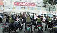 Police arrives outside a hospital where Peru's former President Alan Garcia was taken after he shot himself, in Lima, Peru April 17, 2019. REUTERS/Guadalupe Pardo