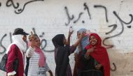 Sudanese demonstrators make victory signs and take selfies during a protest in front of the Defence Ministry in Khartoum, Sudan April 17, 2019. Reuters/Umit Bektas