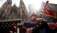 FILE PHOTO: A marching band passes St. Patrick's Cathedral during the annual St. Patrick's Day parade in New York, March 17, 2012. REUTERS/Carlo Allegri/File Photo
