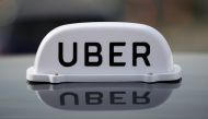 The Logo of taxi company Uber is seen on the roof of a private hire taxi in Liverpool, Britain, April 15, 2019. REUTERS/Phil Noble