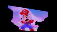FILE PHOTO: Nintendo's game character Super Mario is seen on a screen at the presentation ceremony of Nintendo's new game console Switch in Tokyo, Japan January 13, 2017. REUTERS/Kim Kyung-Hoon