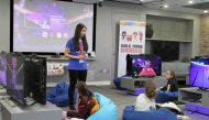 A trainer and computer programmer from Girls Make Games addresses students at an all-day workshop that teaches girls how to design and programme video games in central London, Britain, 12 April, 2019. Thomson Reuters Foundation/ Lin Taylor