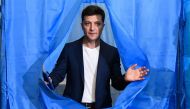 Ukrainian comedian and presidential candidate Volodymyr Zelensky walks out of a voting booth at a polling station during the second round of Ukraine's presidential election in Kiev on April 21, 2019. AFP / Genya Savilov 