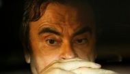 File photo of Former Nissan Motor Chairman Carlos Ghosn sits inside a car as he leaves his lawyer's office after being released on bail from Tokyo Detention House, in Tokyo, Japan, March 6, 2019. REUTERS/Issei Kato/File Photo
 