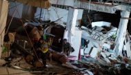 Rescue workers search for survivors in a collapsed Chuzon Super Market in Porac, Pampanga, after a powerful earthquake hit northern Philippines on April 22, 2019. / AFP / Noel CELIS
 