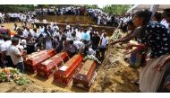 People attend burial ritual of the victims of multiple terror attacks during a funeral ceremony in Negomboo, Sri Lanka ,Tuesday, April 23 , 2019.  Chamila Karunarathne - Anadolu Agency 