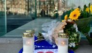 Flowers and candles are left in front of the office building of Danish fashion business Bestseller in Aarhus, Denmark, on April 22, 2019, to pay tribute following the attacks in Sri Lanka. Denmark OUT / AFP / Ritzau Scanpix / Bo Amstrup