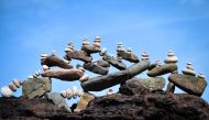 A picture shows a balanced sculpture built during the European Stone Stacking Championships 2019 in Dunbar, Scotland, on April 21, 2019. AFP / Andy Buchanan