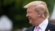 US President Donald Trump smiles during the annual White House Easter Egg Roll on the South Lawn of the White House in Washington, DC on April 22, 2019. / AFP / Jim WATSON