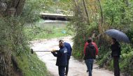 Forensic team search for evidence near the village of Rinas near Tirana on April 10 2019 at the place where police clashed with robbers who stole millions of euros from Austria, Airlines plane. AFP/Gent Shkullaku