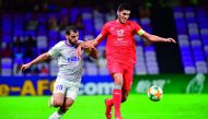 Al Duhail’s midfielder Karim Boudiaf (right) vies for the ball possession with Al Ain’s forward Jamal Ibrahim during their AFC Champions League group C match played at Hazza Bin Zayed Stadium in Al Ain, UAE, yesterday.