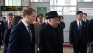 North Korean leader Kim Jong Un (R) attends a meeting with Russia's Minister for the Development of the Russian Far East Alexander Kozlov upon his arrival at a railway station in Khasan, Russia April 24, 2019. 