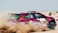 Nasser Saleh Al Attiyah and Matthieu Baumel on their way to winning the recent Qatar International Rally in this file photo.