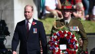 Britain's Prince William proceeds to lay a wreath during the Anzac Day service at Auckland War Memorial Museum on April 25, 2019.  / AFP / Fiona Goodall 