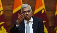 Prime Minister of Sri Lanka Ranil Wickremesinghe gestures as he answers questions from a journalist during a press conference in Colombo on April 23, 2019. AFP/Mohd Rasfan 