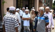 In this photo taken on April 23, 2019, members of the Sri Lanka Muslim community gather outside a mosque after prayers in Colombo. AFP / Mohd Rasfan
