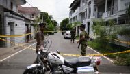 In this photo taken on April 23, 2019, Sri Lankan security personnel stand guard around the house of one of the suspected suicide bombers in Colombo.  AFP / Mohd Rasfan