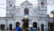 Soldiers stand guard outside St. Anthony's Shrine in Colombo on April 25, 2019, following a series of bomb blasts targeting churches and luxury hotels on the Easter Sunday in Sri Lanka.  AFP / Jewel Samad 

