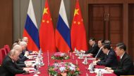 Russian President Vladimir Putin (L) attends a meeting with Chinese President Xi Jinping (R) on the sidelines of the Belt and Road Forum in Beijing on April 26, 2019. / AFP / POOL / Kenzaburo FUKUHARA 