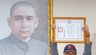Foxconn founder Terry Gou holds a testimonial next to a portrait of Sun Yat-sen as he announces seeking the nomination of Kuomintang party to run for the presidency in Taiwan, April 17, 2019. Reuters/Tyrone Siu