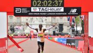 Kenya's Eliud Kipchoge crosses the finish line to win the elite men's race of the 2019 London Marathon in central London on April 28, 2019. AFP / Ben Stansall 