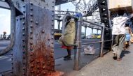 A 2011 file photo taken at Howrah Bridge in Kolkata whose steel at its was then reported being corroded by human saliva. AFP/ Deshakalyan Chowdhury