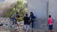 Members of the Libyan internationally recognised government forces fire during a fight with Eastern forces in Ain Zara, Tripoli, Libya April 28, 2019. Reuters/Ismail Zitouny