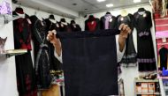 A salesman shows a full face veil, niqab, at a shop selling various kinds of coverings worn by Muslim women in Colombo, Sri Lanka, April 29, 2019. REUTERS/Danish Siddiqui