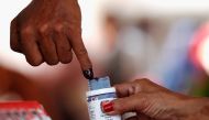 FILE PHOTO: A voter's finger is dipped with ink after voting during elections in Jakarta, Indonesia April 17, 2019. REUTERS/Edgar Su/File Photo