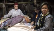 Abdelkader Ouazzani, the last of Morocco's brocade master weavers, displays tapestry at his workshop in the old city of Fes on April 10, 2019.  AFP / Fadel Senna 
