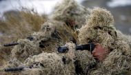 Soldiers of the People's Liberation Army (PLA) Marine Corps are seen in training at a military training base in Bayingol, Xinjiang Uighur Autonomous Region, January 20, 2016. Reuters