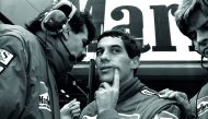  Ayrton Senna of Brazil talks with his McLaren team member during the final practice session for Sunday's Japanese Grand Prix in Suzuka October 29, 1988.  Reuters/Masaharu Hatano