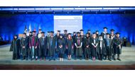 UCL Qatar’s new class of graduates pose for a group photo.