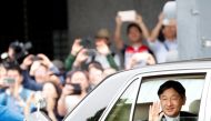 Japan's new Emperor Naruhito waves as he leaves the Imperial Palace in Tokyo, Japan May 1, 2019. REUTERS/Kim Kyung-Hoon