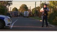 Police officers and vehicles are seen behind police cordon, in Christchurch, New Zealand in this still image taken from video April 30, 2019. TVNZ via Reuters TV