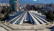 This aerial picture taken in Tirana, Albania, on February 7, 2019 shows a general view of Tirana's pyramid, a former museum that was named after late Albanian communist dictator Enver Hoxha. AFP / Gent Shkullaku 