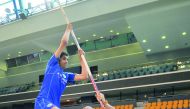 Piotr Lisek, pole vaulter gives some tips to an Aspire Academy student during a session at Aspire Academy yesterday.