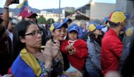 Venezuelan residents in Colombia protest against Venezuelan President Nicolas Maduro's government in Bogota, Colombia, May 1, 2019. Reuters/Carlos Julio Martinez