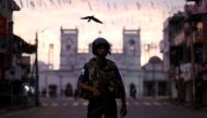 A security officer stands guard outside St. Anthony's Shrine, days after a string of suicide bomb attacks on churches and luxury hotels across the island on Easter Sunday, in Colombo, Sri Lanka April 26, 2019. REUTERS/Athit Perawongmetha 