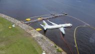 This image released by the US Navy shows a Boeing 737 aircraft in the St. Johns River May 4, 2019 after sliding off the runway at Naval Air Station Jacksonville, Florida on May 3, 2019. AFP PHOTO / US NAVY / Mass Communication Specialist 3rd Class Thomas 