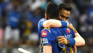 Mumbai Indians cricketer Krunal Pandya hugs his teammate and sibling Hardik Pandya after winning the 2019 Indian Premier League (IPL) Twenty20 cricket match between Mumbai Indians and Sunrisers Hyderabad at the Wankhede Stadium cricket stadium in Mumbai o
