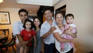 Reuters journalist Wa Lone (3rd R) poses with his wife Pan Ei Mon (2nd R) and daughter along with his colleague Kyaw Soe Oo (L) carrying his daughter and his wife Chit Su Win after being freed from prison in a presidential amnesty in Yangon on May 7, 2019