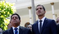 File photo of Juan Guaido (R), new President of the National Constituent Assembly and lawmaker of the Venezuelan opposition party Popular Will (Partido Voluntad Popular), and lawmaker Edgar Zambrano of Democratic Action party (Accion Democratica), leave t