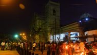 Sri Lankan Catholic devotees pray at St Anthony's church after it was partially opened for the first time since the Easter Sunday attacks in Colombo on May 7, 2019. AFP / ISHARA S. KODIKARA
