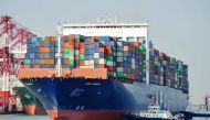 FILE PHOTO: A US cargo ship berthing at a port in Qingdao in China's eastern Shandong province.  China OUT / AFP 