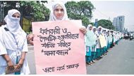 Students of Ibn Sina Nursing Institute stage a human chain in Kalyanpur yesterday, protesting the rape and killing of Shahinoor Akhter Tania. Photo courtesy: The Daily Star 