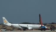 A general view shows a Myanmar National Airlines passenger plane after an emergency landing at Mandalay international airport on May 12, 2019. AFP / STR